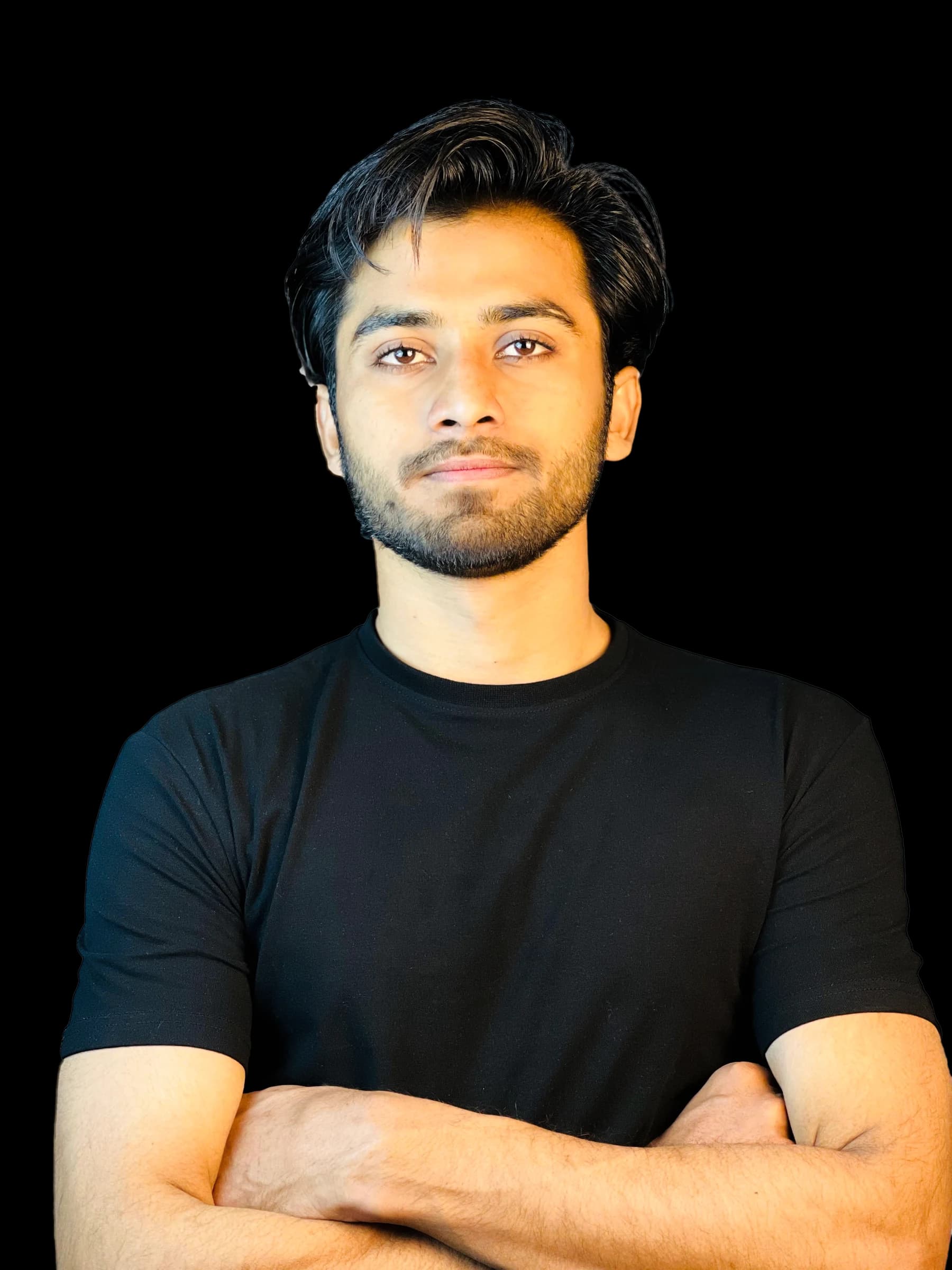 Junaid Umer, arms crossed, in a black t-shirt